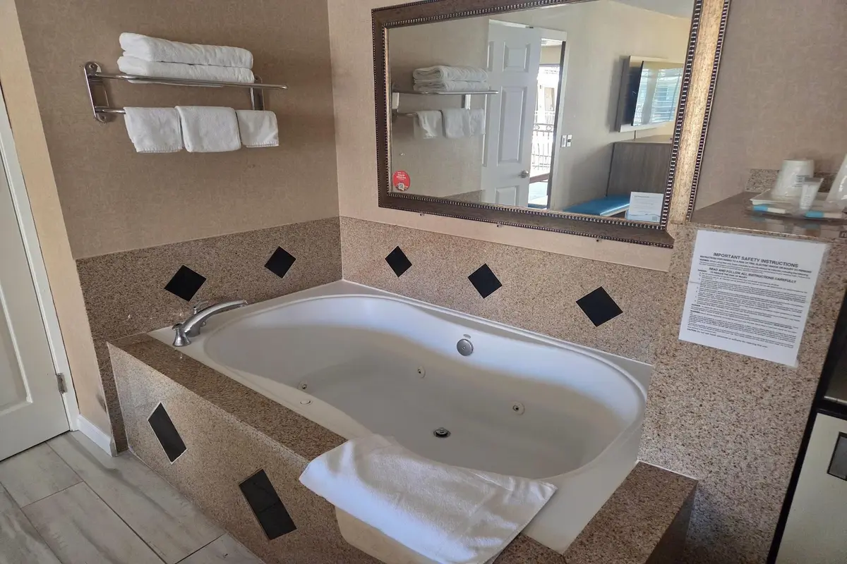 A jacuzzi tub inside a verified motel room