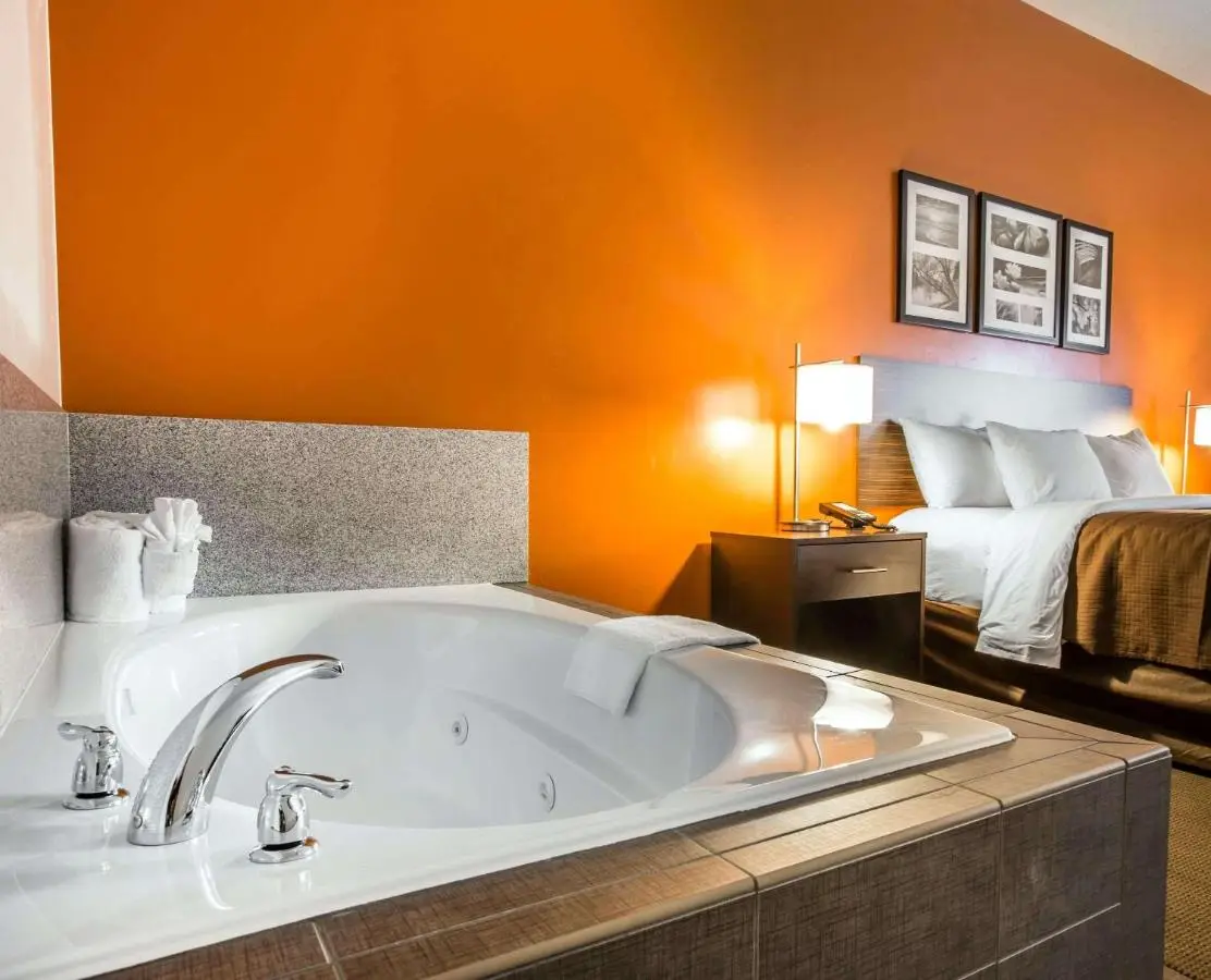 A hotel jacuzzi room at a property with an indoor pool